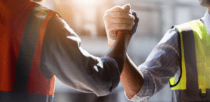 leussink - two workmen complete a task