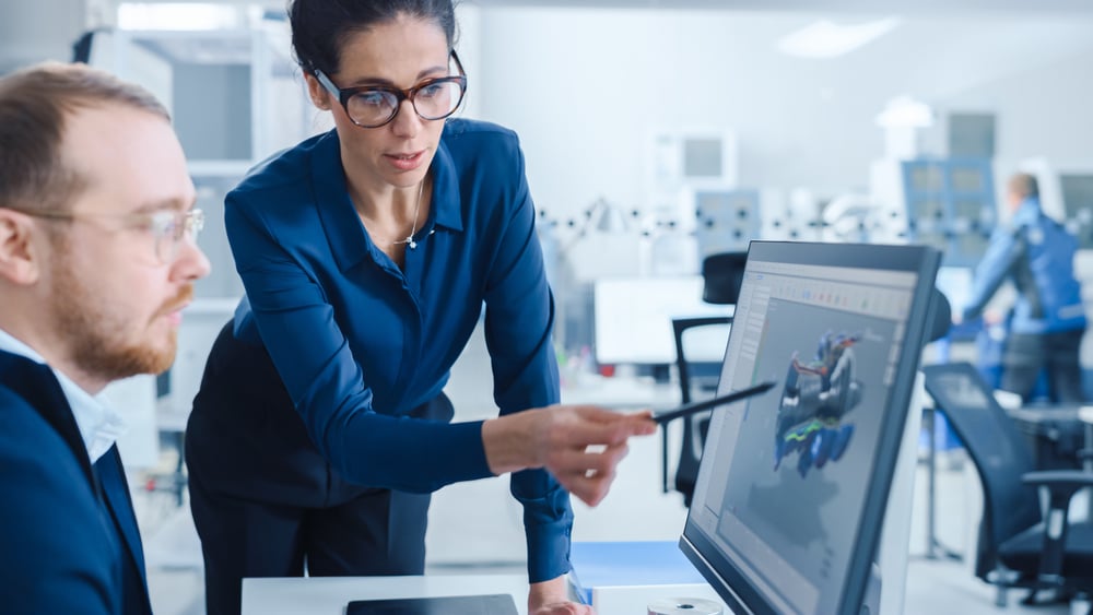 Modern,factory:,female,project,supervisor,talks,to,a,male,industrial